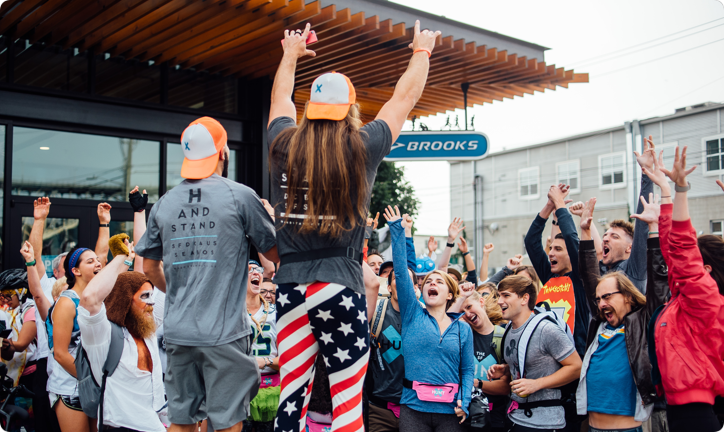 Corporate team gathered outdoors at the kickoff of a Handstand scavenger hunt