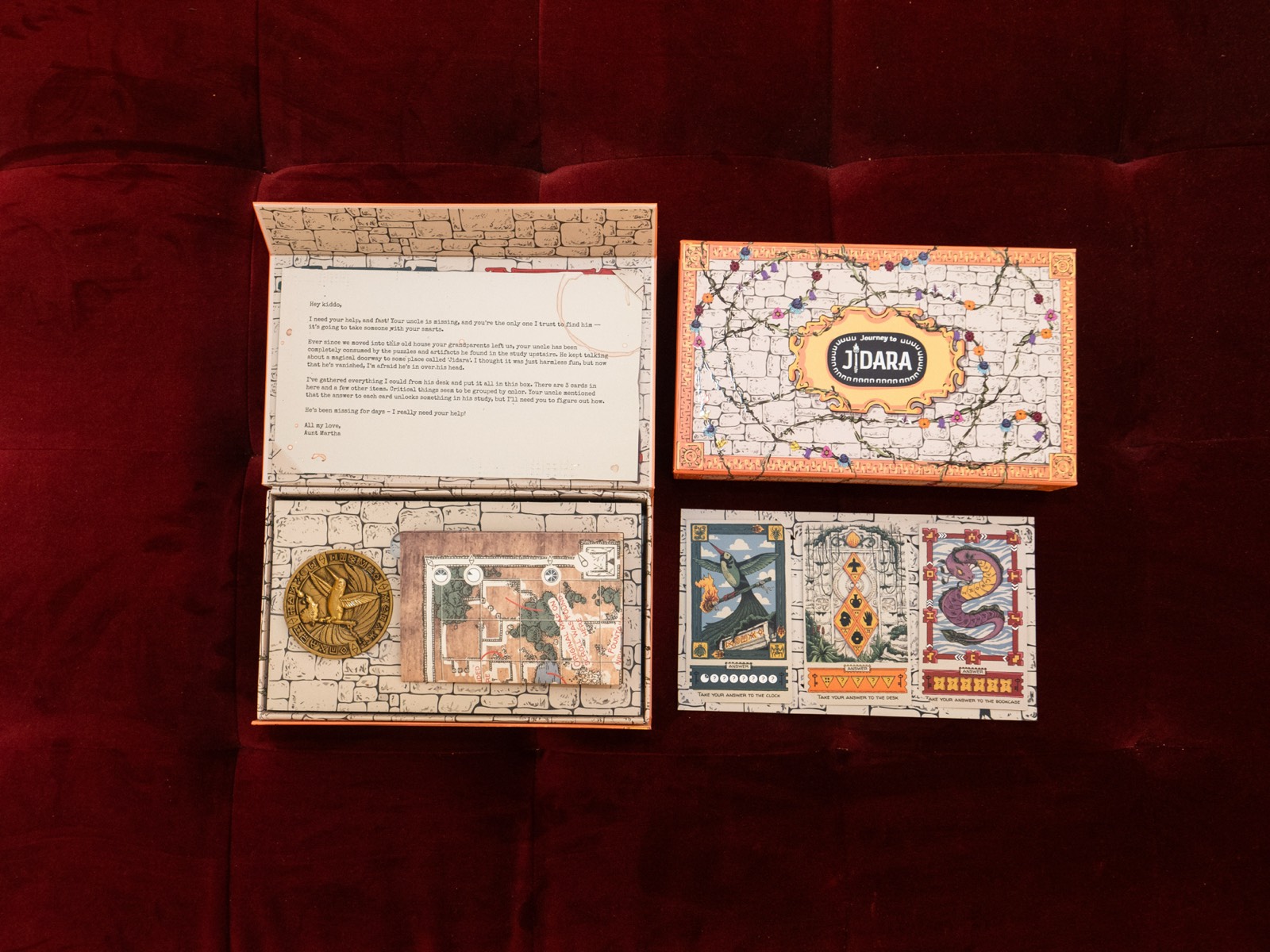 All puzzle box contents and clues laid out showing full experience