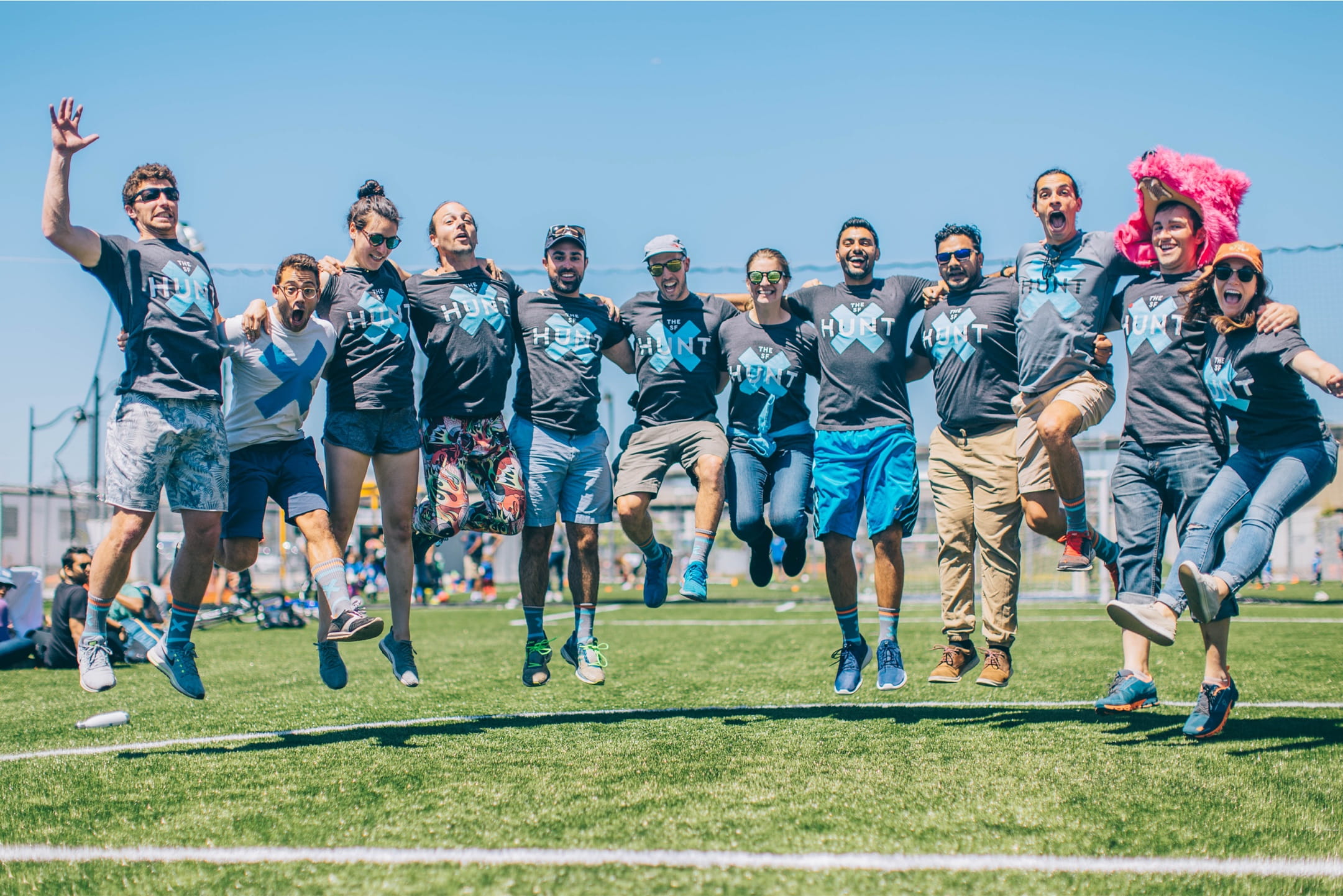 The Handstand team jumping in the air together